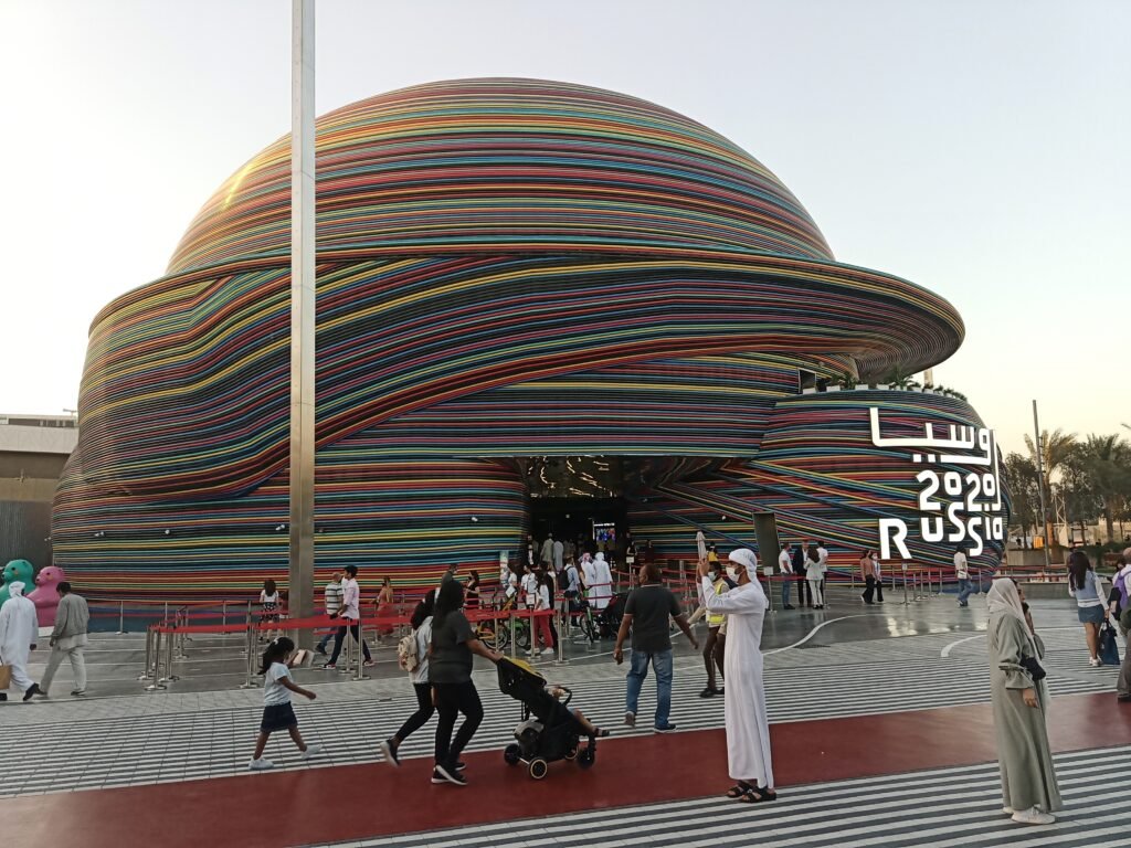 Visitors exploring the colorful Russian Pavilion at the Dubai Property Show in Sydney, part of global real estate exhibitions.