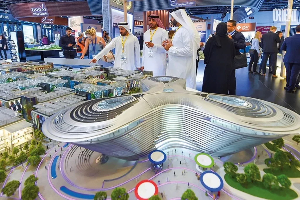 Dubai Property Show in Sydney with visitors examining the Dubai skyline model, highlighting luxury residences and commercial spaces.